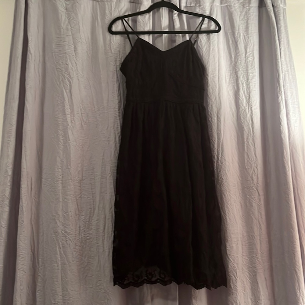 Black lace, v-neck dress. Gold detailing, new with tags.